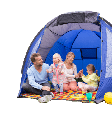 Family of four with two young children sat on a colourful blanket inside a blue tent