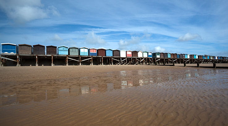 Beach huts overlooking Frinton-on-Sea Beach in Essex