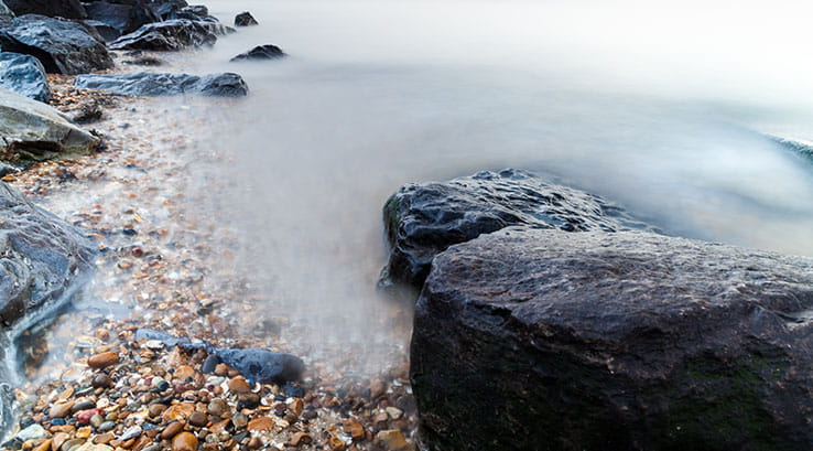 Waves rolling into the rocky beach at Shoebury East, Essex