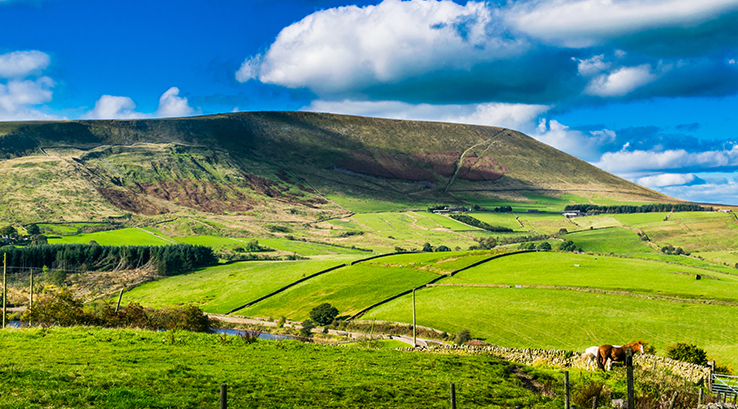 Blue skies and clouds over Pendle Hill