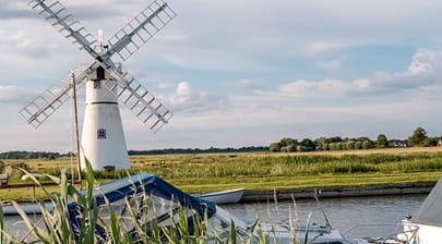 windmill next to water