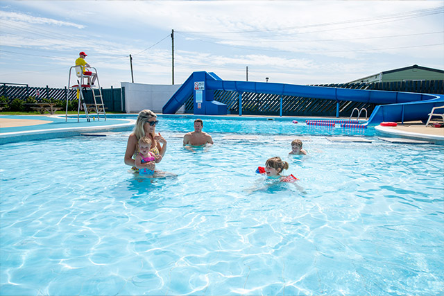 A family having fun in the outdoor pool at Barmston Beach