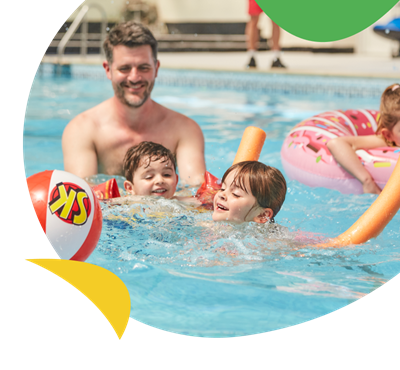A family playing in the swimming pool at Breydon Water Holiday Park