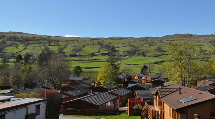 The lodges and countryside views at Limefitt Holiday Park
