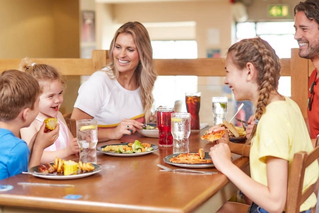 A family meal in the restaurant at Lower Hyde Holiday Park