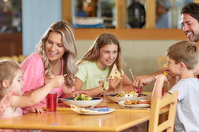 A family enjoying a meal in the restaurant