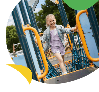 A young girl on the adventure playground at Nodes Point Holiday Park
