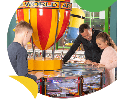 A family playing on the amusement arcades at Skipsea Sands Holiday Park