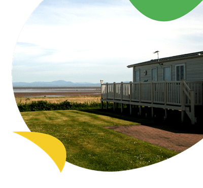 A holiday caravan looking out to sea at Southerness Holiday Park