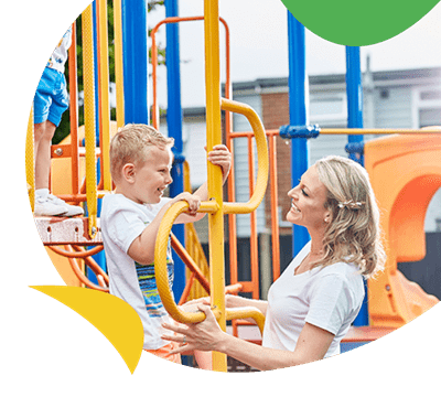 Mother and daughter in adventure playground at Summerfields Holiday Park
