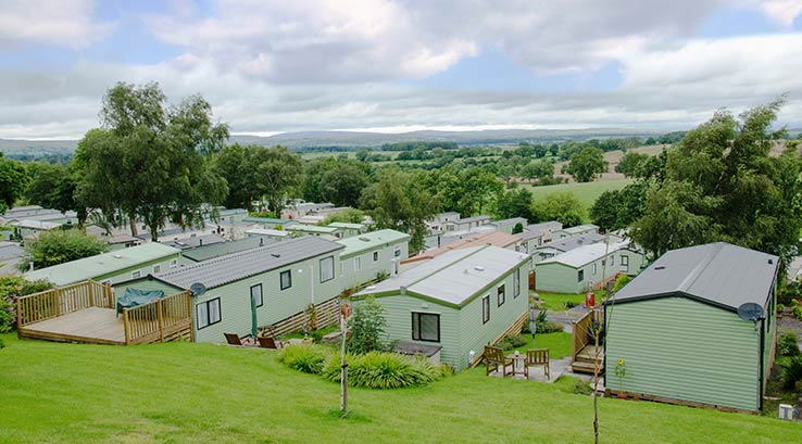 Caravans and surrounding countryside at Todber Valley Holiday Park