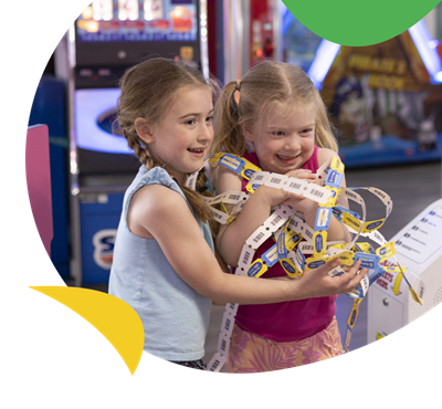 Two girls winning in the arcade at Torquay Holiday Park