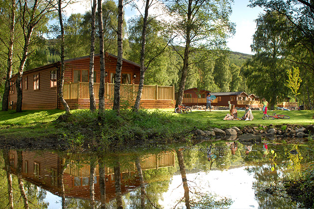 Lodges by the river at Tummel Valley holiday park