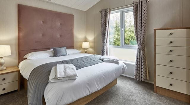 Double bedroom inside a lodge at Ty Mawr Holiday Park