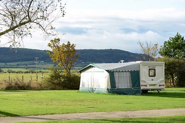 A touring caravan and awning at Ty Mawr