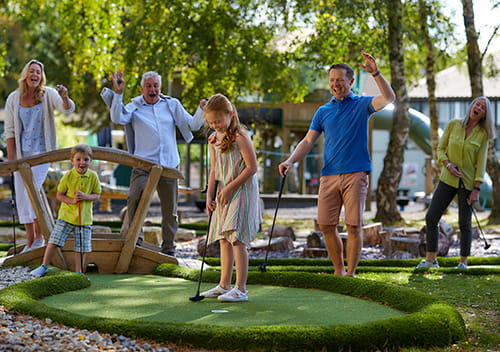 Family playing crazy golf