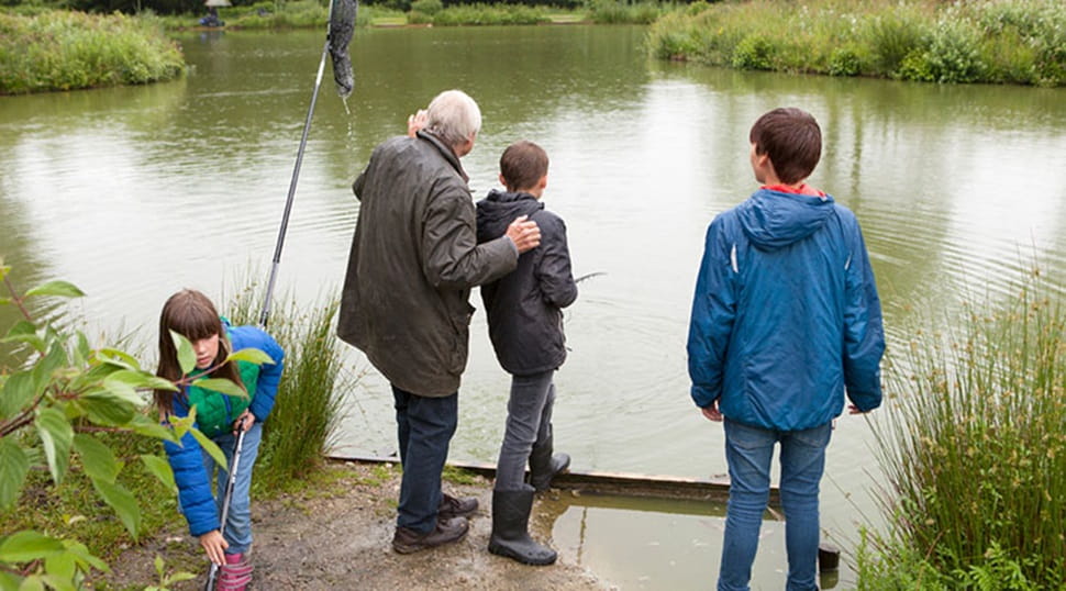 grandfather and grandchildren fishing
