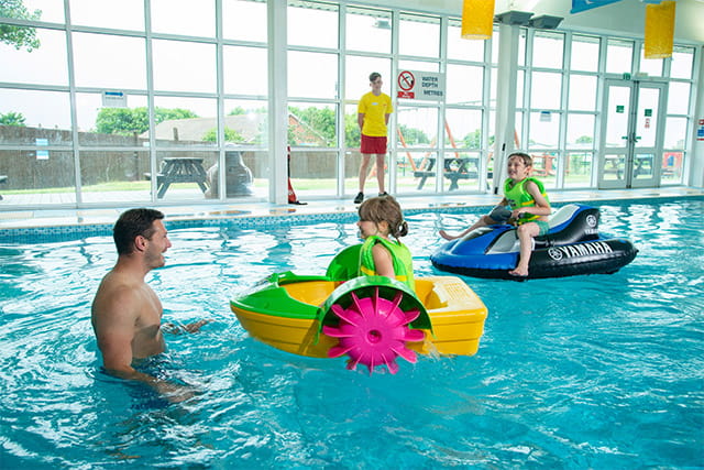 Kids on Aqua Paddlers and Inflatable Jet Skis at Withernsea Holiday Park