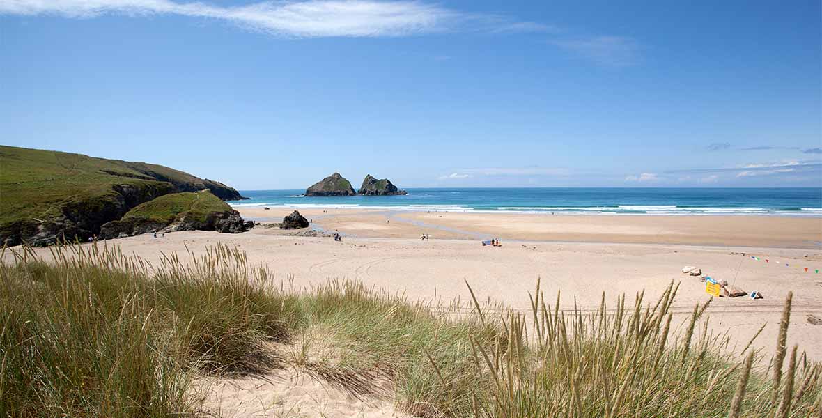 Holywell Bay Beach in Cornwall on a sunny day
