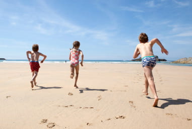 Children running on beach