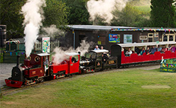 Families riding on the miniature steam train at Lappa Valley in Cornwall