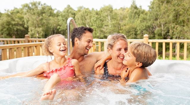 Family relaxing in hot tub