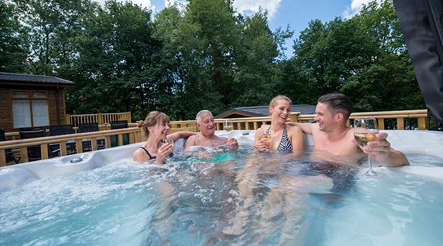 Family relaxing in a hot tub