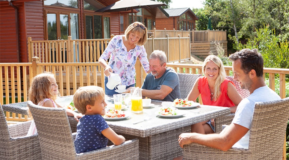 family enjoying a meal on a veranda