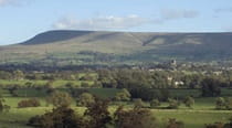 A view across the trees of Pendle Hill in Lancashire