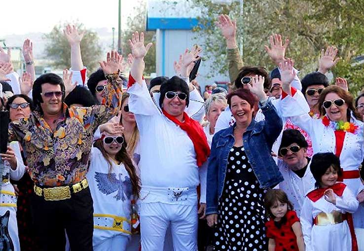 A group of people all dressed as Elvis Presley