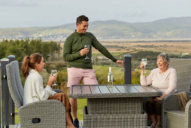 Family on decking furniture
